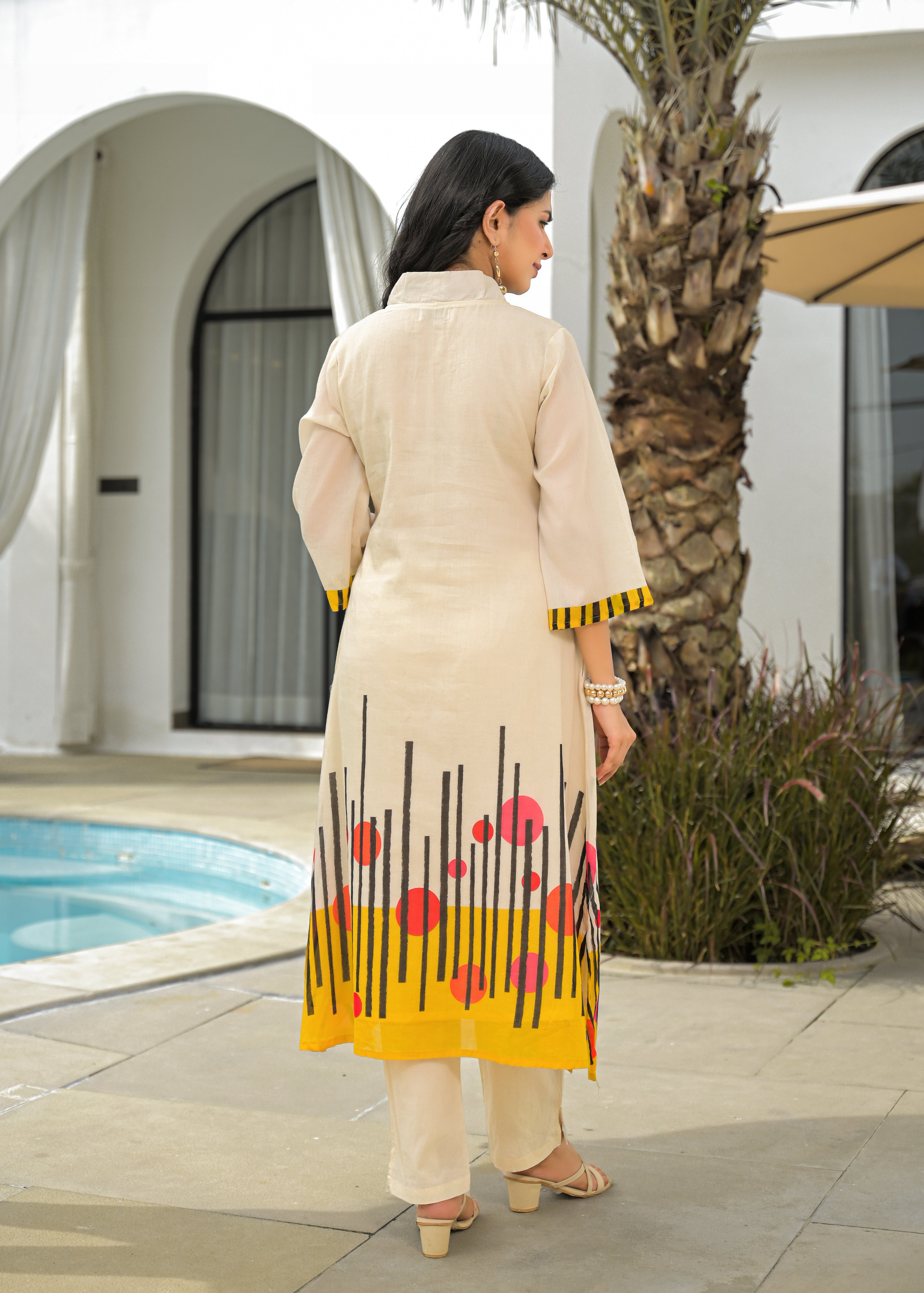 Beige Cotton A-Line Kurta Set with Abstract Yellow & Red Printed Hem – Festive & Casual Wear for Women